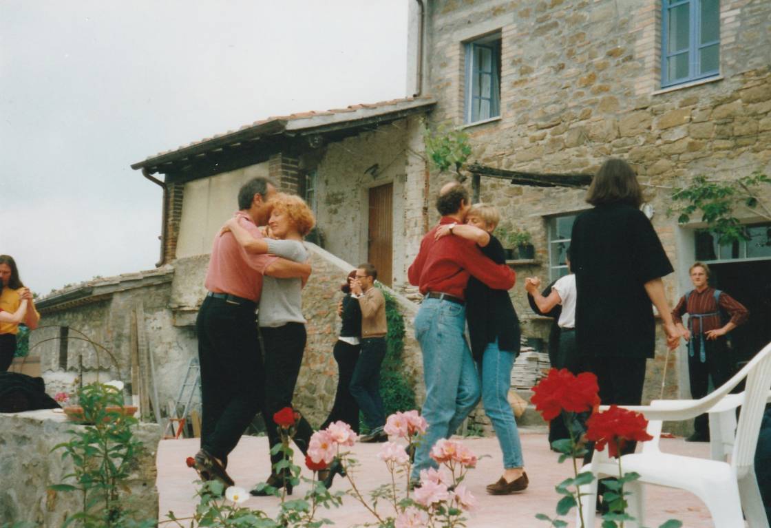 The first Tango class in La Rogaia, May 1999 with Marina Jablonski. Participants dancing on the rose-lined terrace of Villa La Rogaia